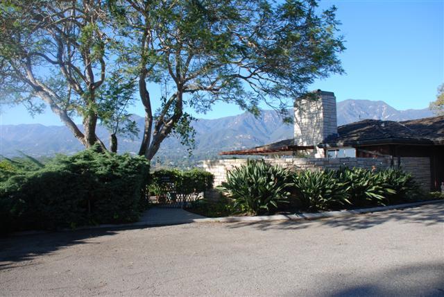 239 Ortega Ridge Road Montecito, CA 93108 - Photo 3 of 4 a view of a street with potted plants and large trees