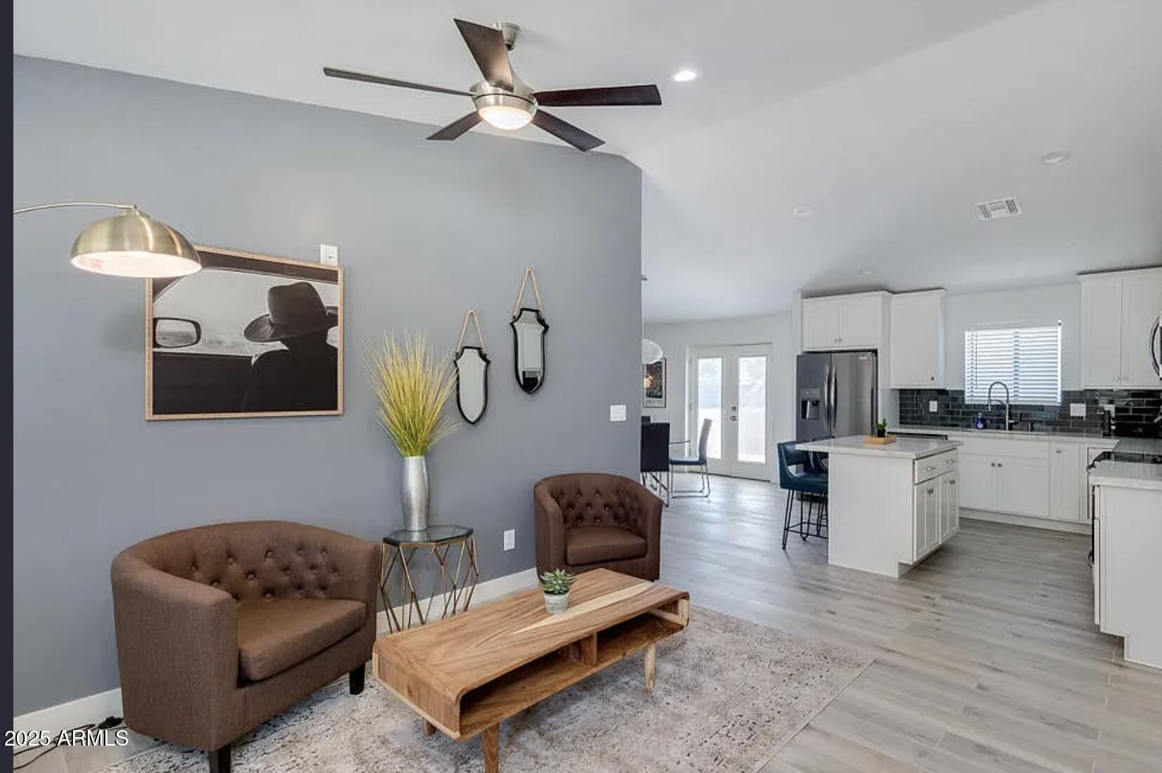 1101 East Weldon Avenue Phoenix, AZ 85014 - Photo 5 of 9 a living room with furniture and kitchen view