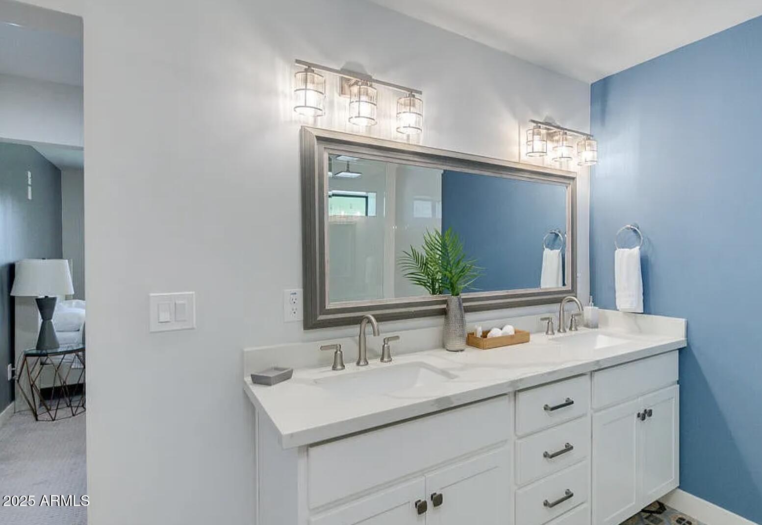 1101 East Weldon Avenue Phoenix, AZ 85014 - Photo 6 of 9 a bathroom with a sink double vanity and a mirror