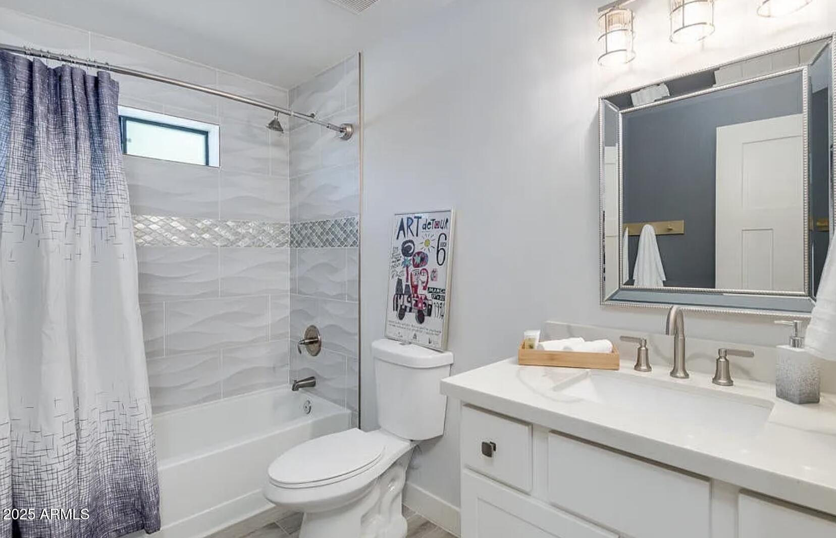 1101 East Weldon Avenue Phoenix, AZ 85014 - Photo 7 of 9 a bathroom with a granite countertop sink a toilet and shower
