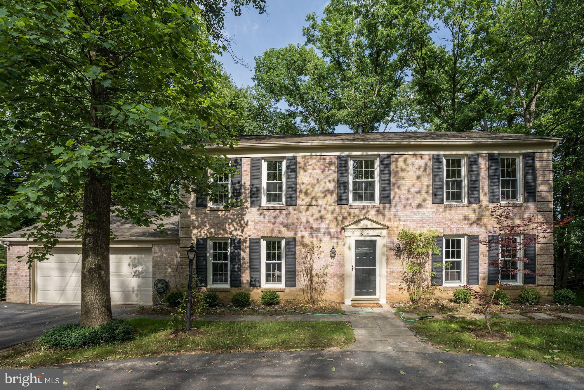 Great curb appeal colonial on a lush wooded lot.