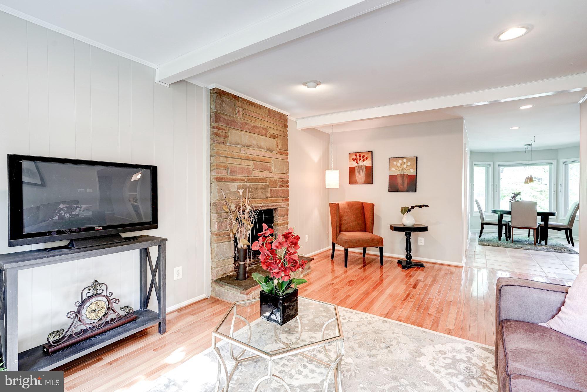 9219 Fernwood Road Bethesda, MD 20817 - Photo 13 of 29 Family Room with fireplace off kitchen