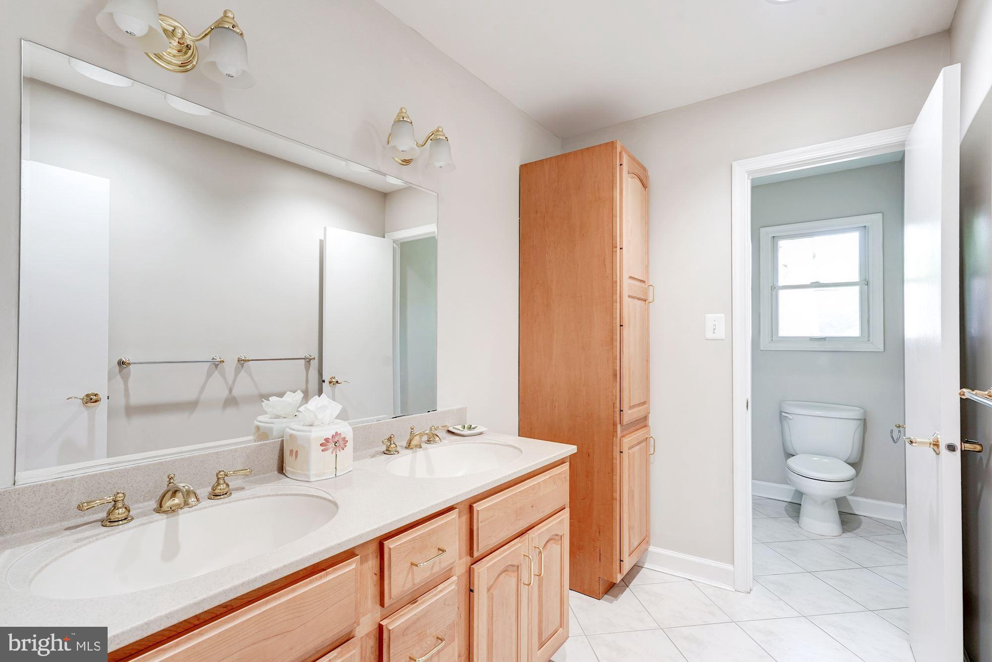 9219 Fernwood Road Bethesda, MD 20817 - Photo 24 of 29 Hall bath has double vanity and separate tub area