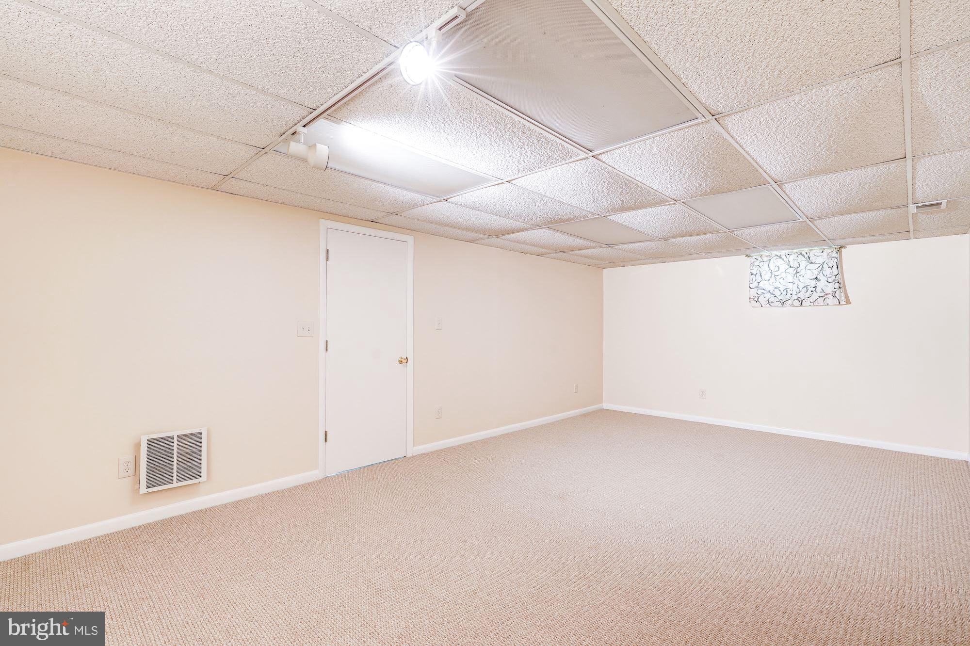 9219 Fernwood Road Bethesda, MD 20817 - Photo 25 of 29 Lowe level spacious Rec. Room, new w/w carpet