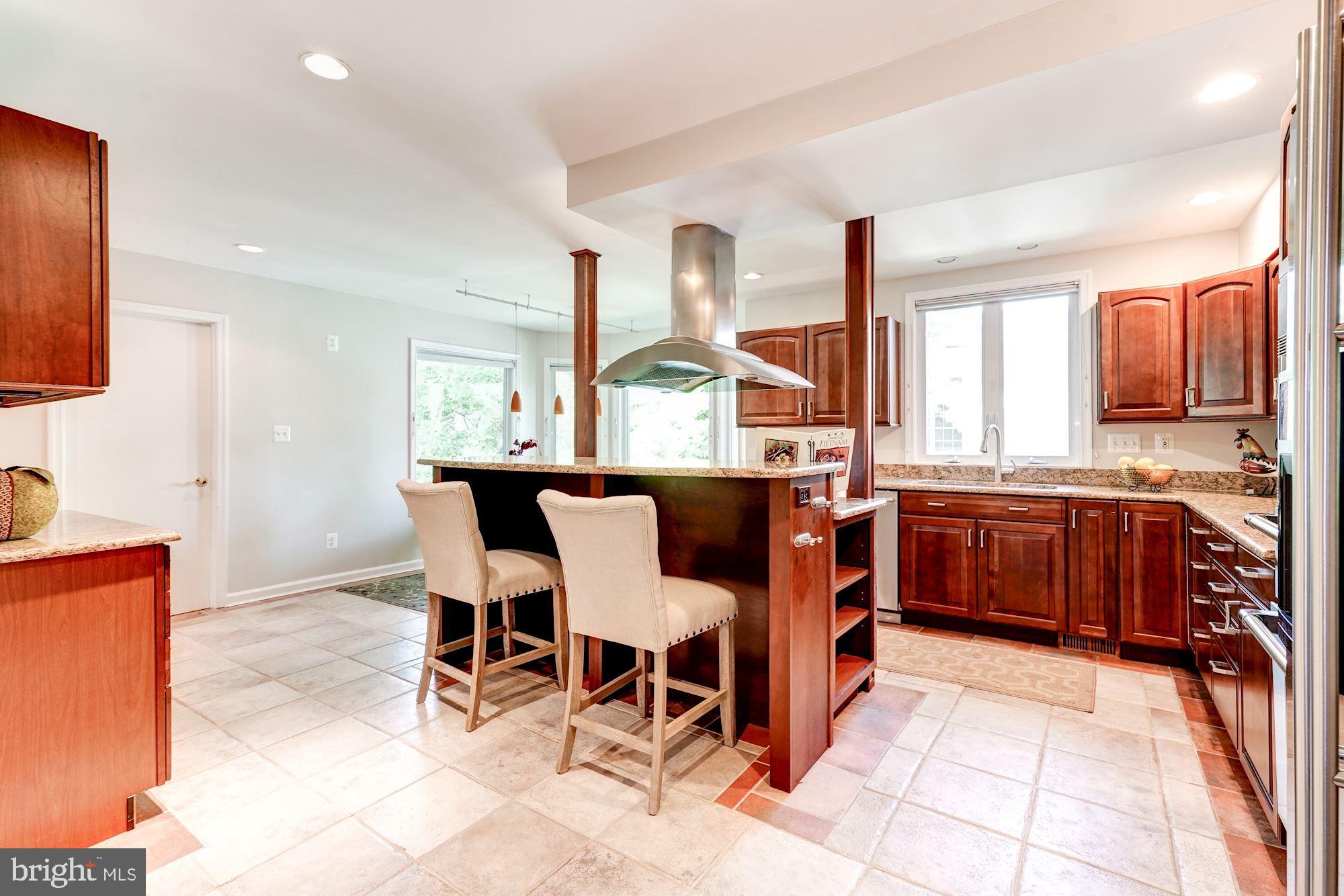 9219 Fernwood Road Bethesda, MD 20817 - Photo 9 of 29 Gourmet kitchen with breakfast bar