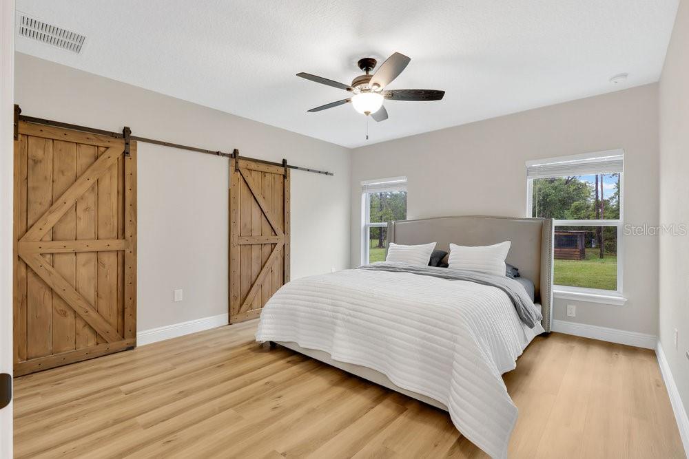 9054 Lincoln Road St. Cloud, FL 34773 - Photo 11 of 33 a bedroom with a bed and a window