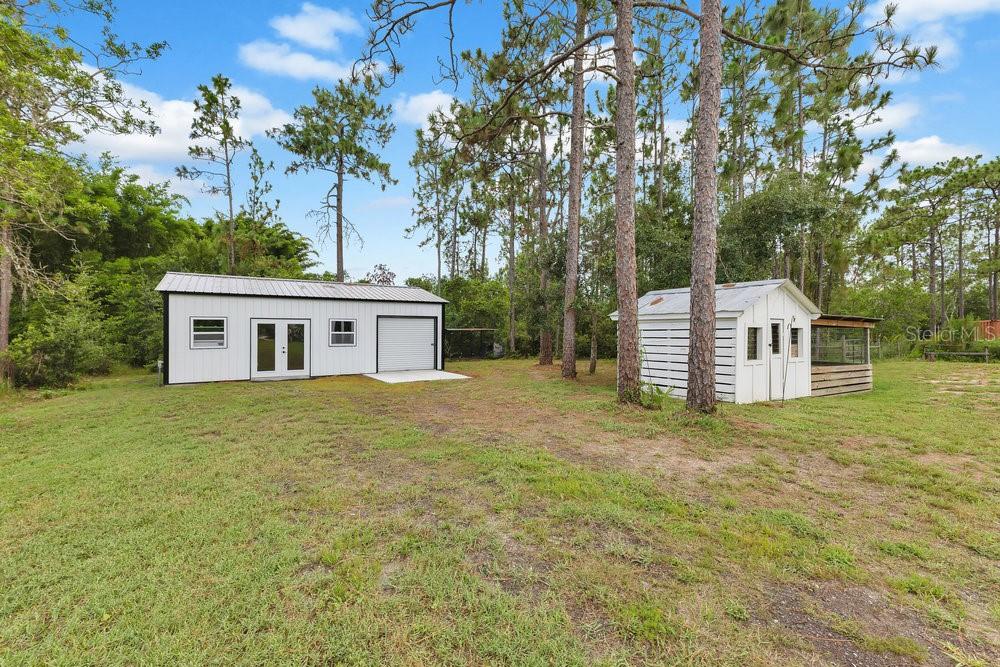 9054 Lincoln Road St. Cloud, FL 34773 - Photo 26 of 33 a view of a house with a yard