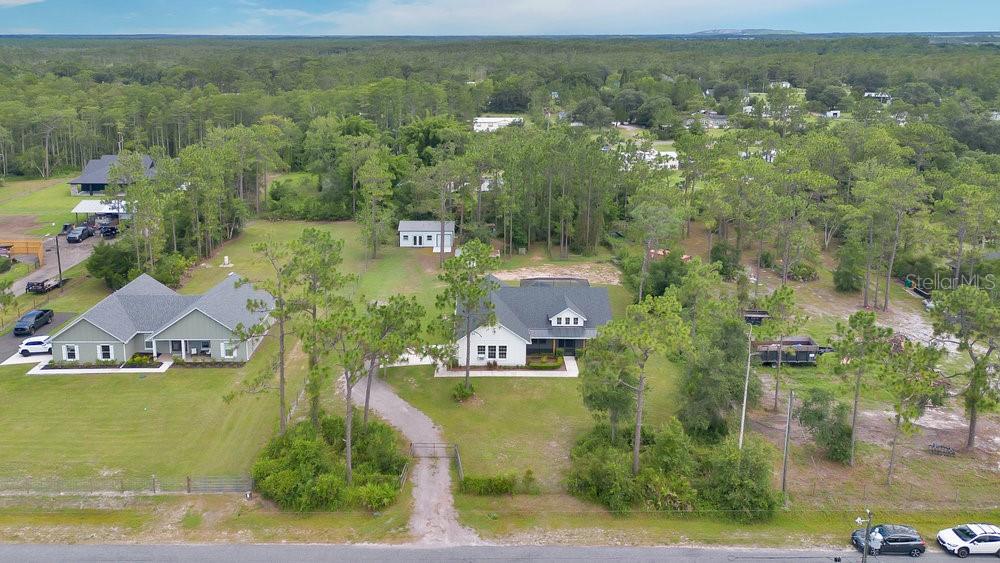 9054 Lincoln Road St. Cloud, FL 34773 - Photo 30 of 33 an aerial view of residential houses with outdoor space and swimming pool