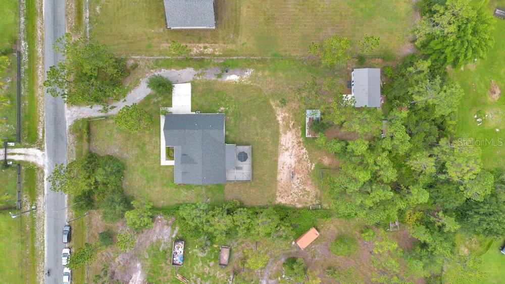 9054 Lincoln Road St. Cloud, FL 34773 - Photo 31 of 33 an aerial view of a house with a yard