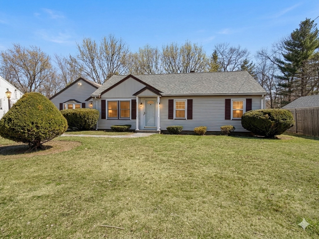 22 Oakdale Road Canton, MA 02021 - Photo 25 of 25 a front view of a house with a garden