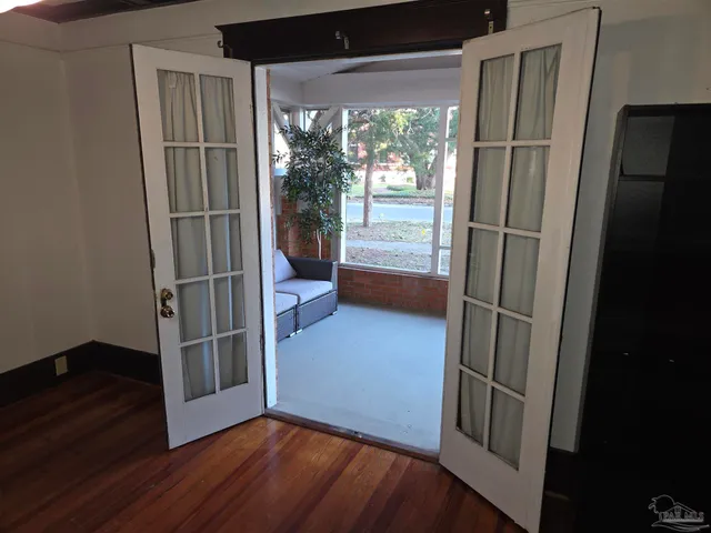 a view of entryway with wooden floor