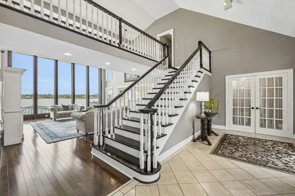 a kitchen with stainless steel appliances kitchen island granite countertop a stove a sink and a refrigerator