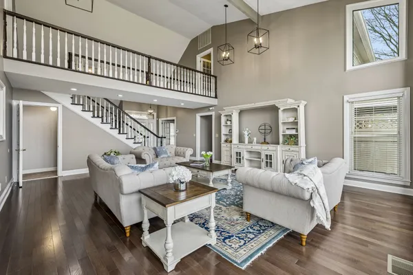 a spacious bedroom with a large bed and a flat screen tv