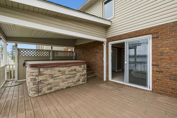 a view of a house with a big yard and large trees