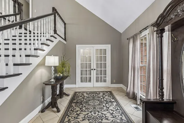 a living room with furniture and a table