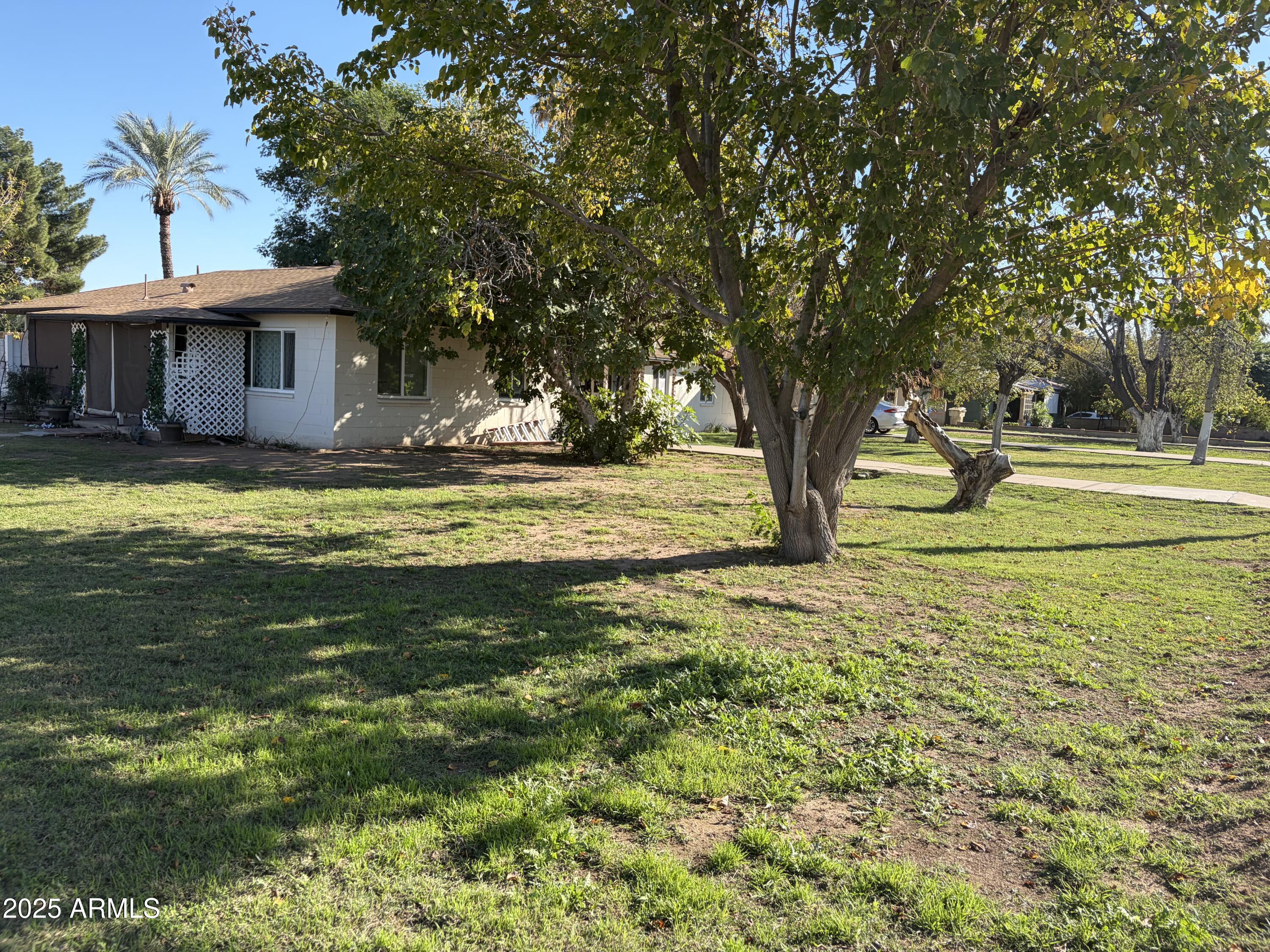5963 West Ocotillo Road Glendale, AZ 85301 - Photo 5 of 12 a view of a house with a yard