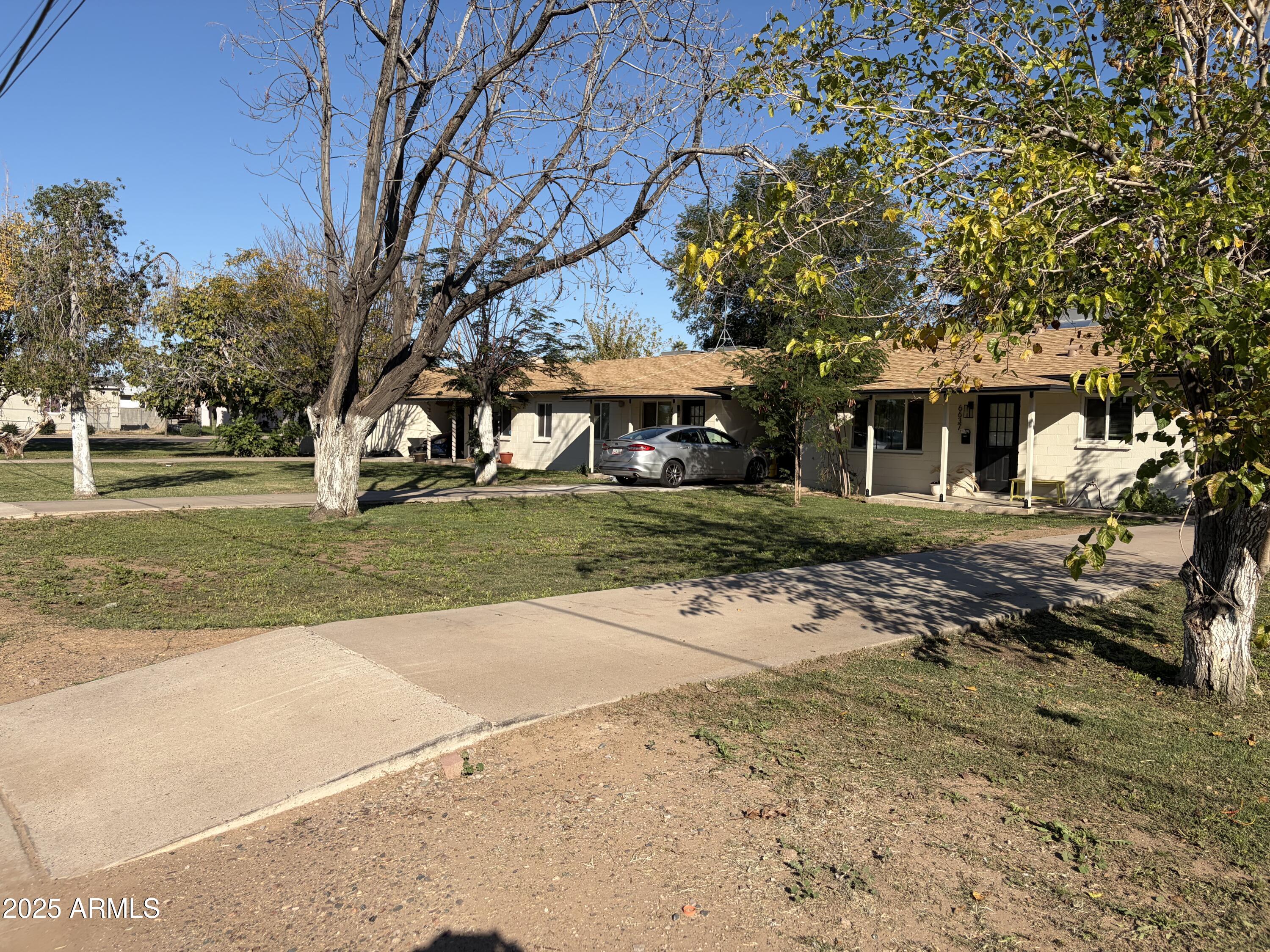 5963 West Ocotillo Road Glendale, AZ 85301 - Photo 9 of 12 front view of a house with a yard