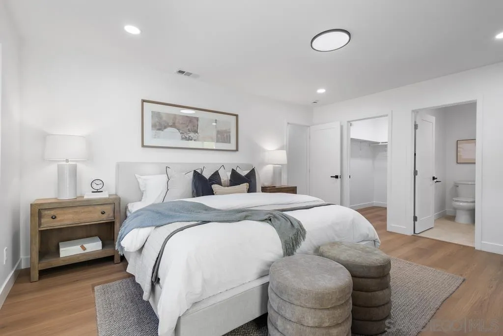 4516 Shade Road La Mesa, CA 91941 - Photo 13 of 33 a spacious bedroom with a bed and a couch