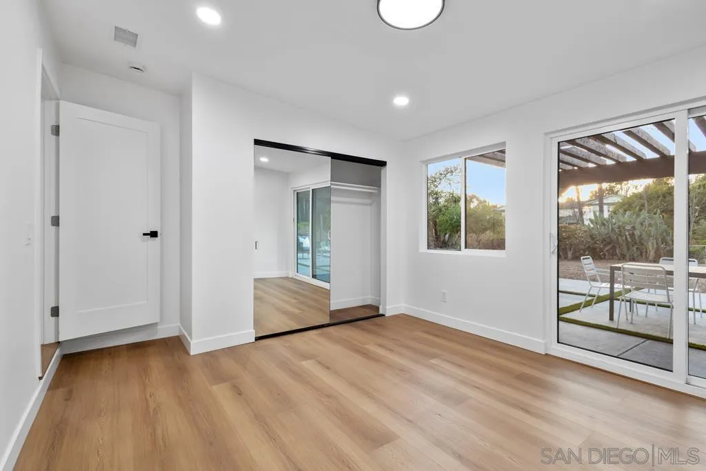 4516 Shade Road La Mesa, CA 91941 - Photo 25 of 33 a view of an empty room with wooden floor and a window