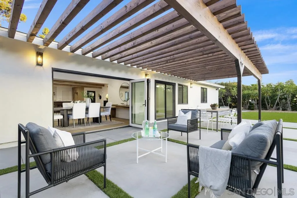4516 Shade Road La Mesa, CA 91941 - Photo 26 of 33 a view of a patio with couches chairs and couches with wooden floor and fence