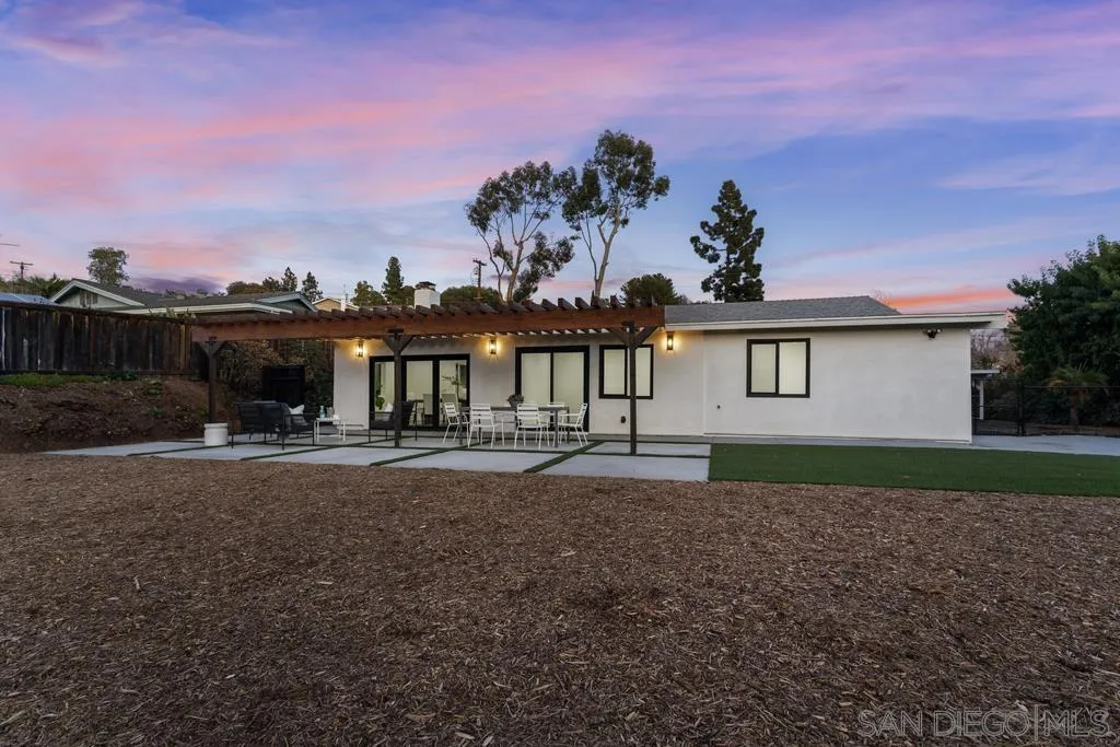 4516 Shade Road La Mesa, CA 91941 - Photo 28 of 33 a front view of a house with a garden and yard