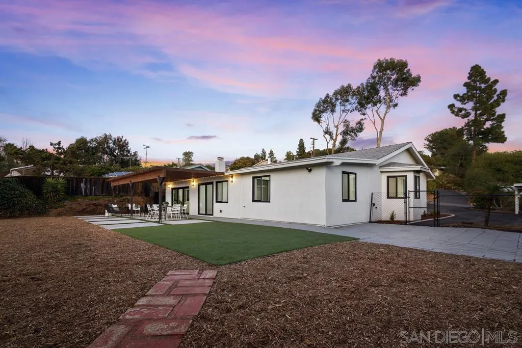 4516 Shade Road La Mesa, CA 91941 - Photo 29 of 33 a front view of a house with a yard and garage