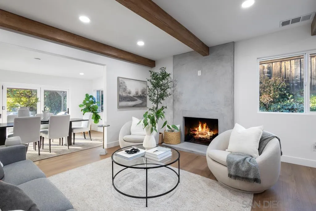 4516 Shade Road La Mesa, CA 91941 - Photo 9 of 33 a living room with furniture a fireplace a rug and a window