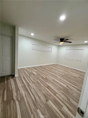 an empty room with wooden floor