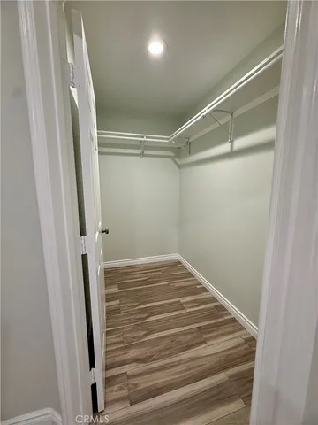 a view of a room with wooden floor and staircase