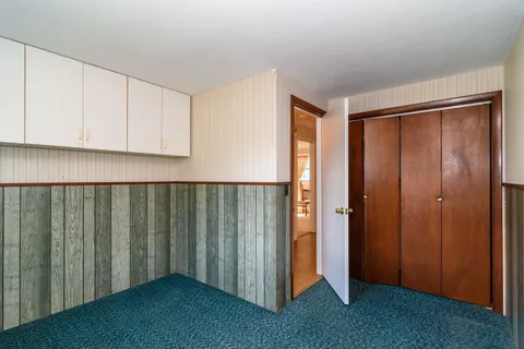 a view of an empty room and entryway