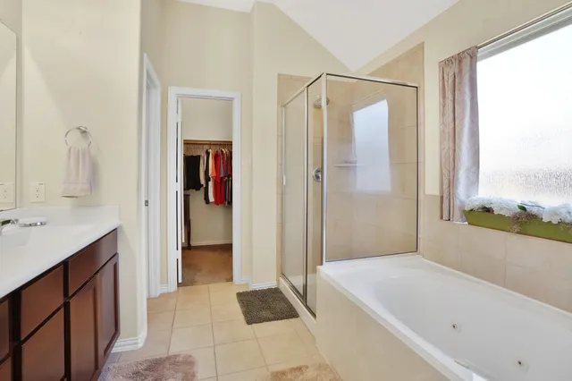 a bathroom with a bathtub and a sink