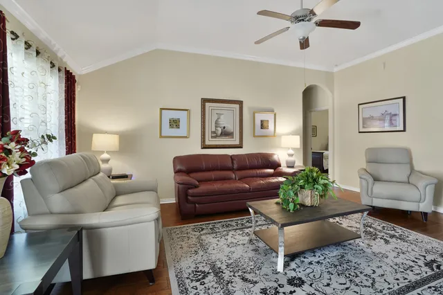 a living room with furniture and a rug