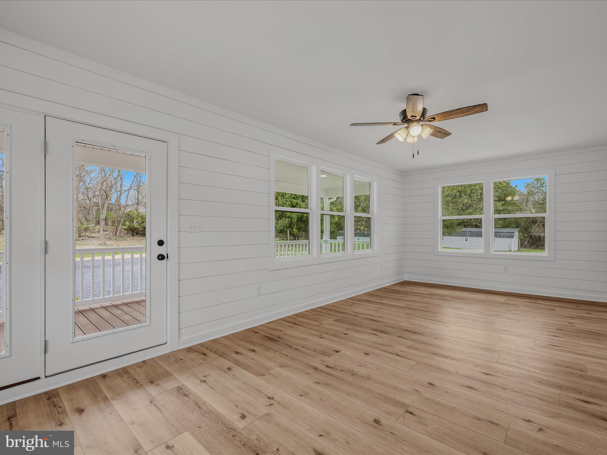 89 Morgan Grove Road Shepherdstown, WV 25443 - Photo 17 of 68 a view of an empty room with a window and wooden floor