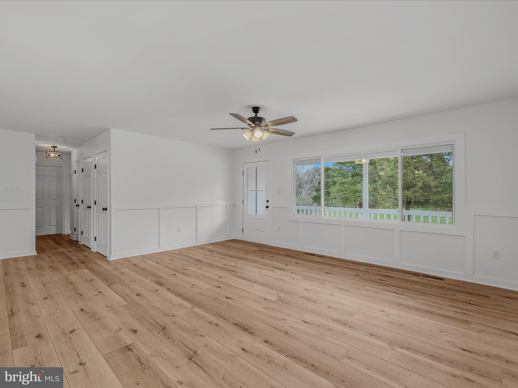 89 Morgan Grove Road Shepherdstown, WV 25443 - Photo 18 of 68 a view of empty room with wooden floor and ceiling fan