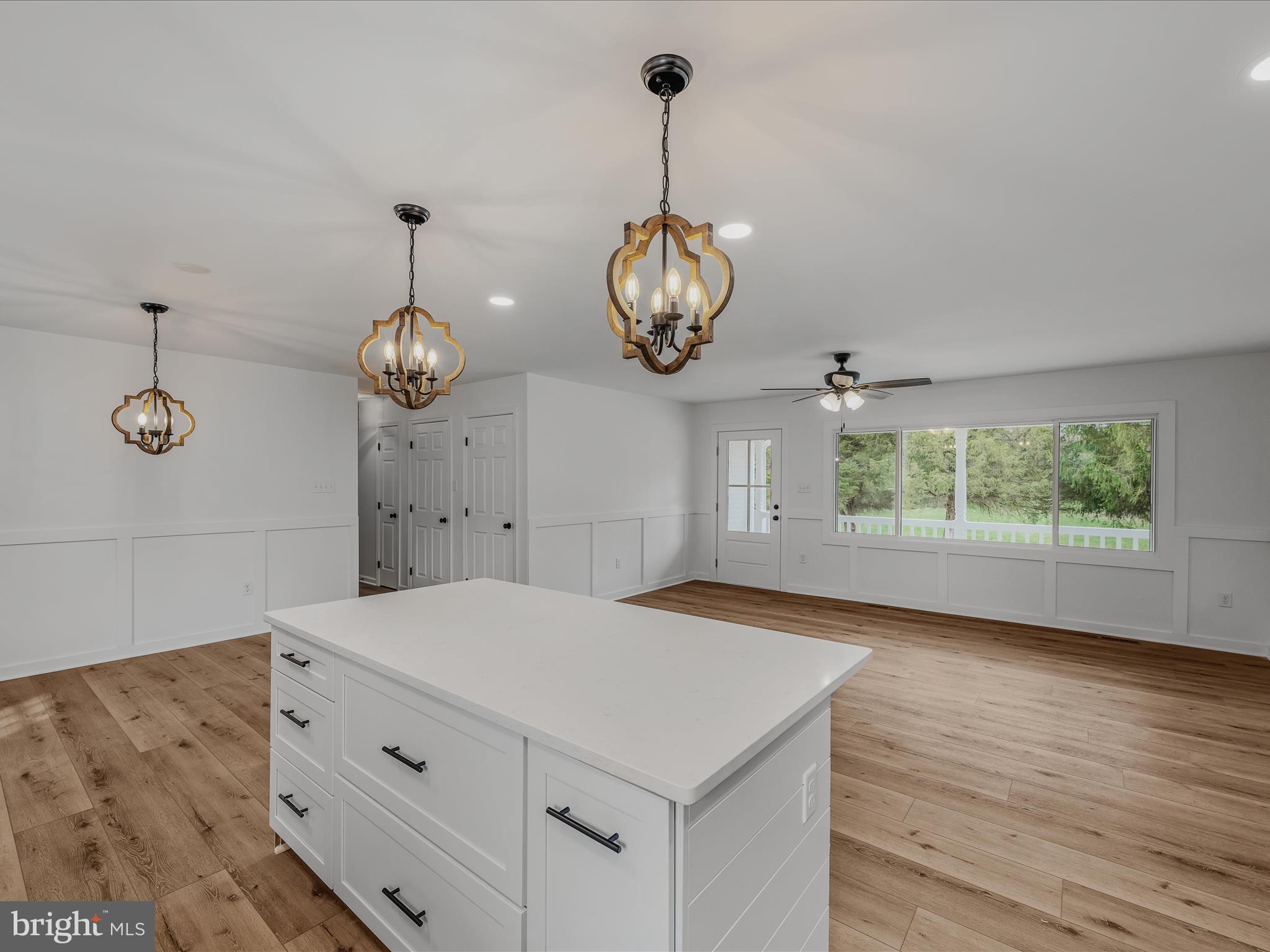 89 Morgan Grove Road Shepherdstown, WV 25443 - Photo 24 of 68 a kitchen with a refrigerator a chandelier and wooden floor