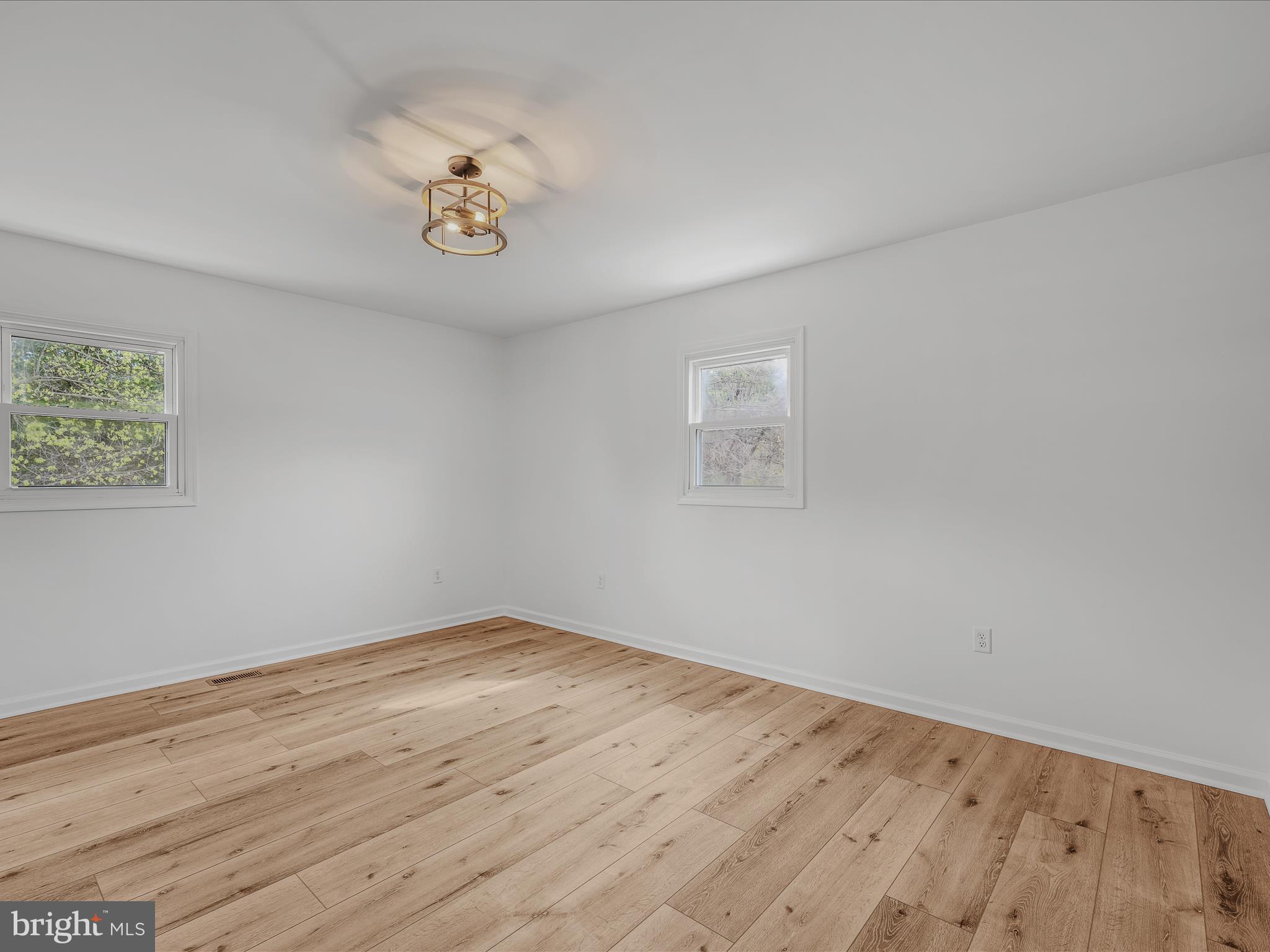 89 Morgan Grove Road Shepherdstown, WV 25443 - Photo 28 of 68 a view of a room with wooden floor and white walls