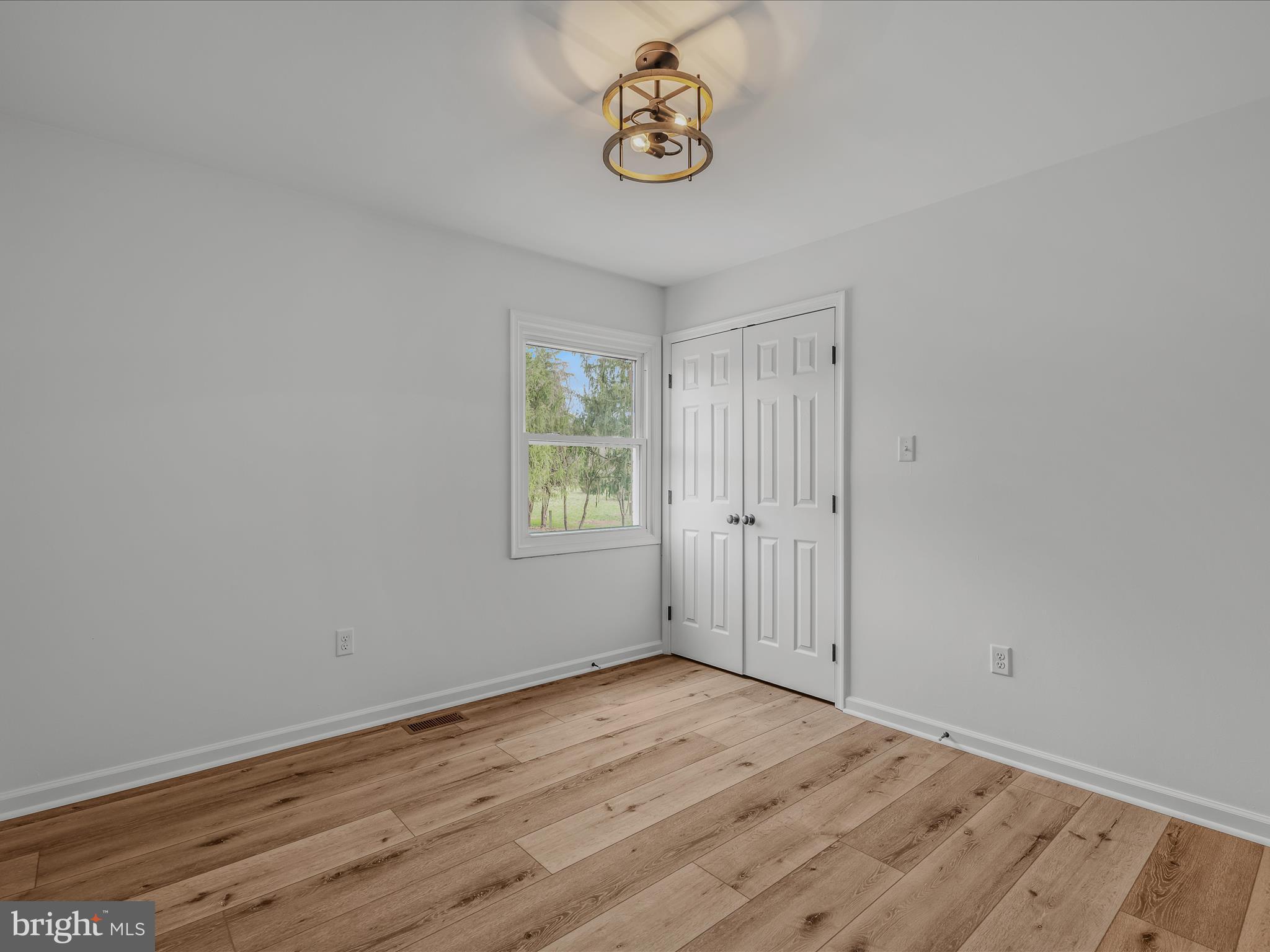 89 Morgan Grove Road Shepherdstown, WV 25443 - Photo 34 of 68 an empty room with wooden floor and window