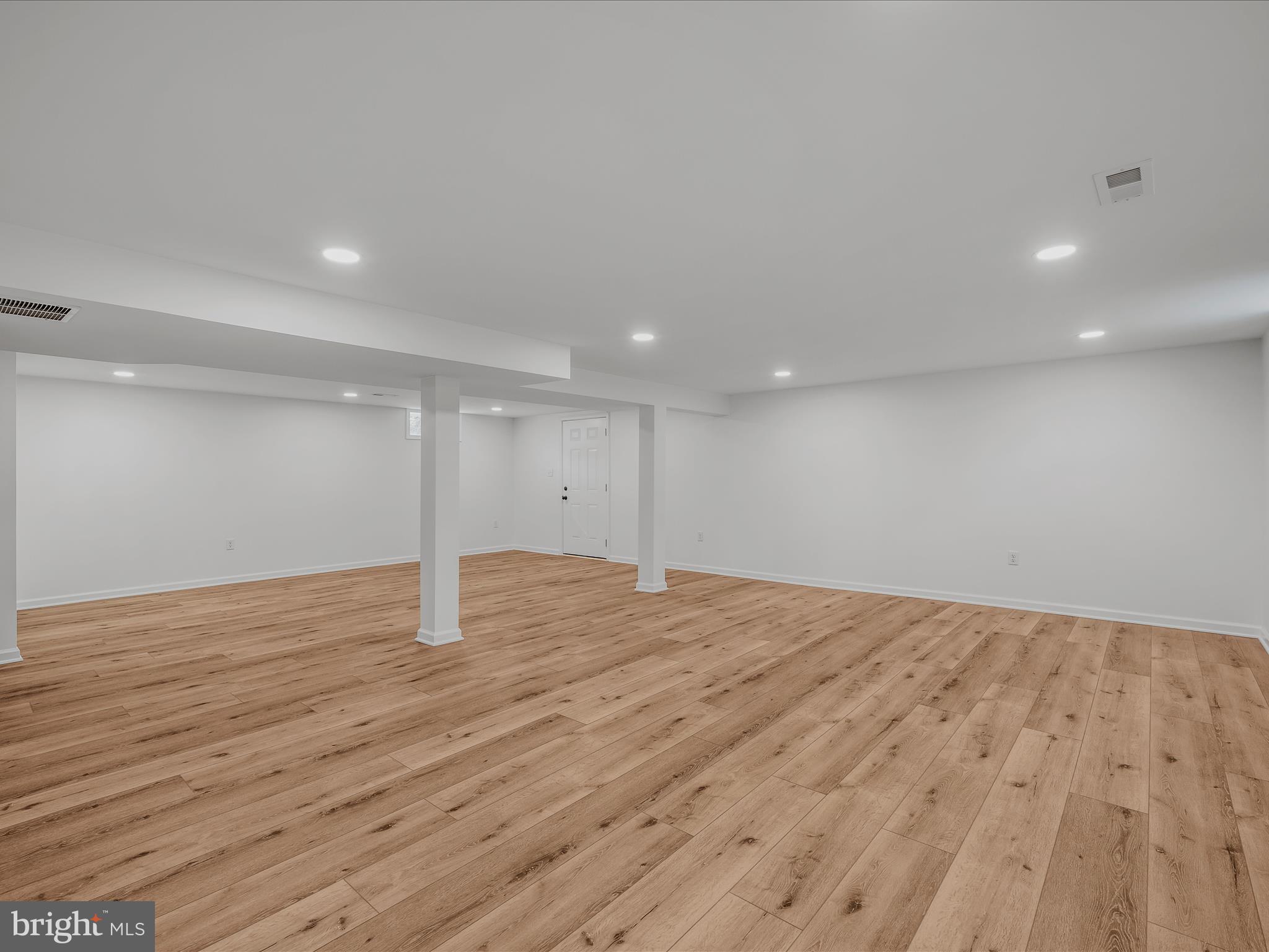 89 Morgan Grove Road Shepherdstown, WV 25443 - Photo 36 of 68 a view of an empty room with wooden floor and a painting on the wall