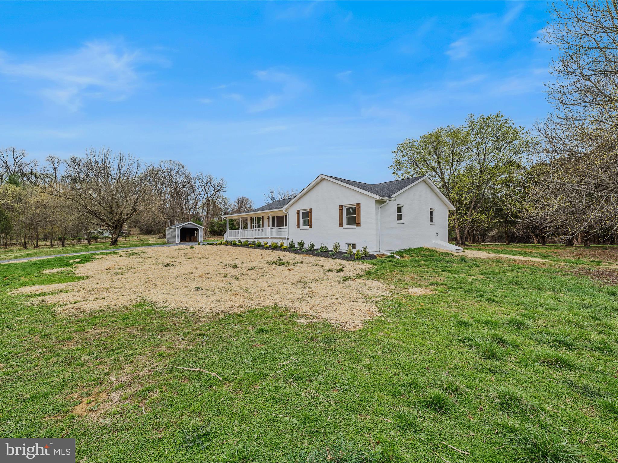 89 Morgan Grove Road Shepherdstown, WV 25443 - Photo 48 of 68 a view of white house with a big yard