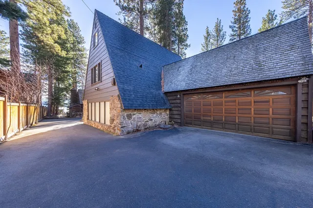 a view of a house with a yard and garage