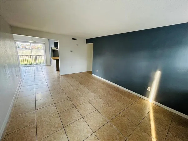 a view of an empty room and window