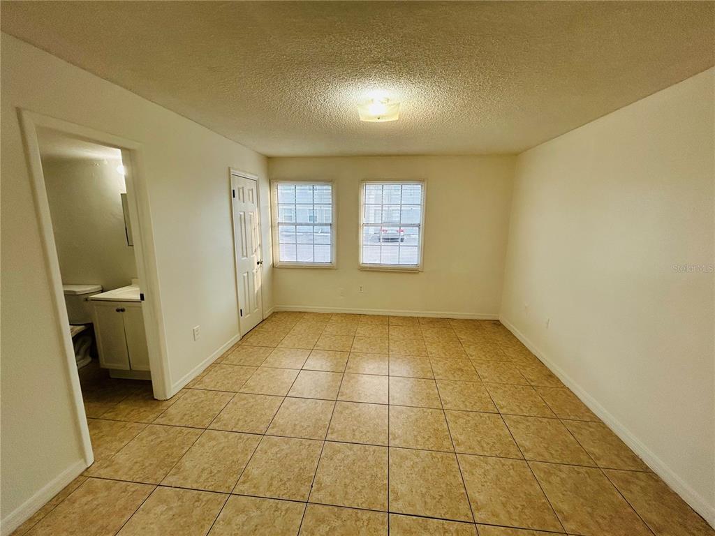2775 L B McLeod Road, Unit B Orlando, FL 32805 - Photo 9 of 11 a view of an empty room and window