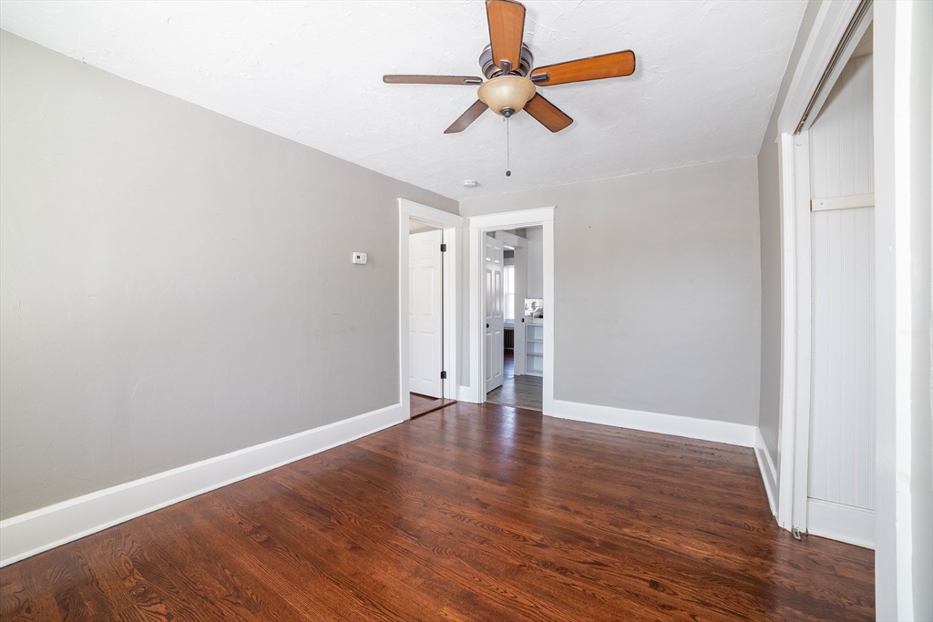 5 Maple Avenue, Unit 2 Oxford, MA 01537 - Photo 17 of 22 a view of an empty room with window and wooden floor
