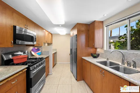 a kitchen that has a sink and a stove
