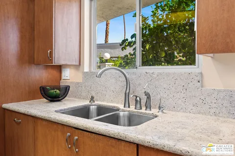 a kitchen with a sink and a microwave