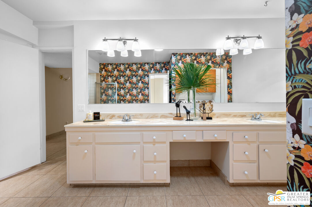 2033 Ramon Road, Unit 2C Palm Springs, CA 92264 - Photo 29 of 35 a bathroom with a sink vanity and a mirror