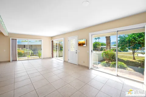 a view of an empty room with windows