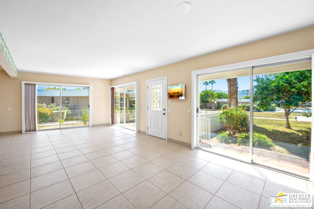 2033 Ramon Road, Unit 2C Palm Springs, CA 92264 - Photo 7 of 35 a view of an empty room with windows