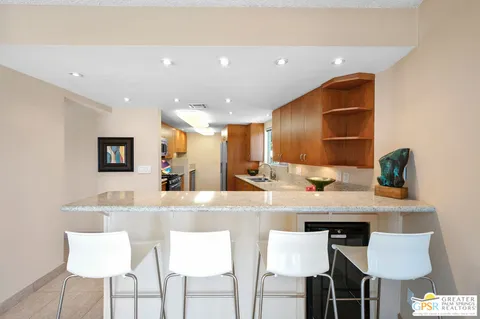 a kitchen with a table and chairs in it