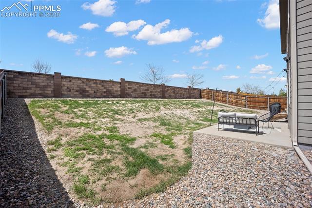 7148 Red Cardinal Loop Colorado Springs, CO 80908 - Photo 44 of 50 Fenced backyard with a patio area